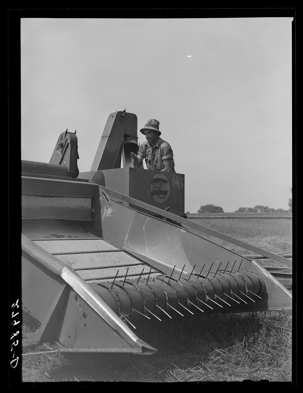 Combine harvester for timothy grass seed. Jasper County, Iowa. Sourced from the Library of Congress.