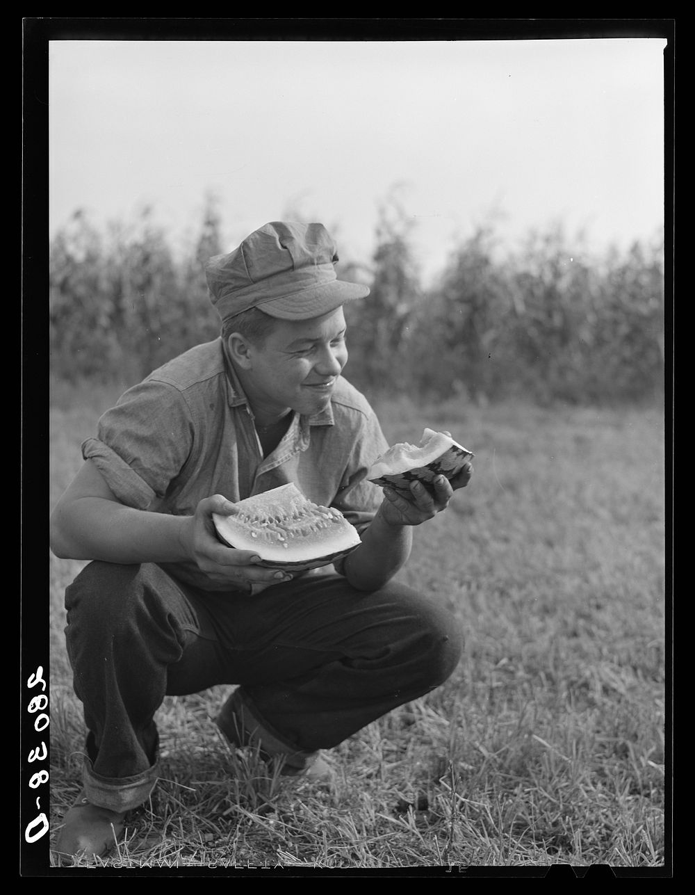 Bud Kimberley eating watermelon. Jasper County, Iowa. Sourced from the Library of Congress.