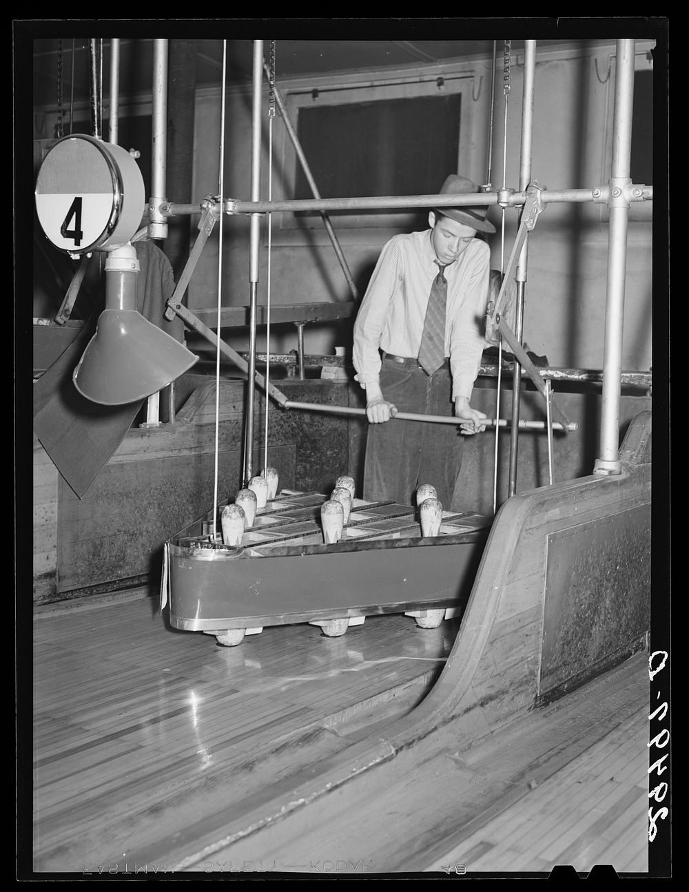[Untitled photo, possibly related to: Pin boy in bowling alley. Clinton, Indiana]. Sourced from the Library of Congress.