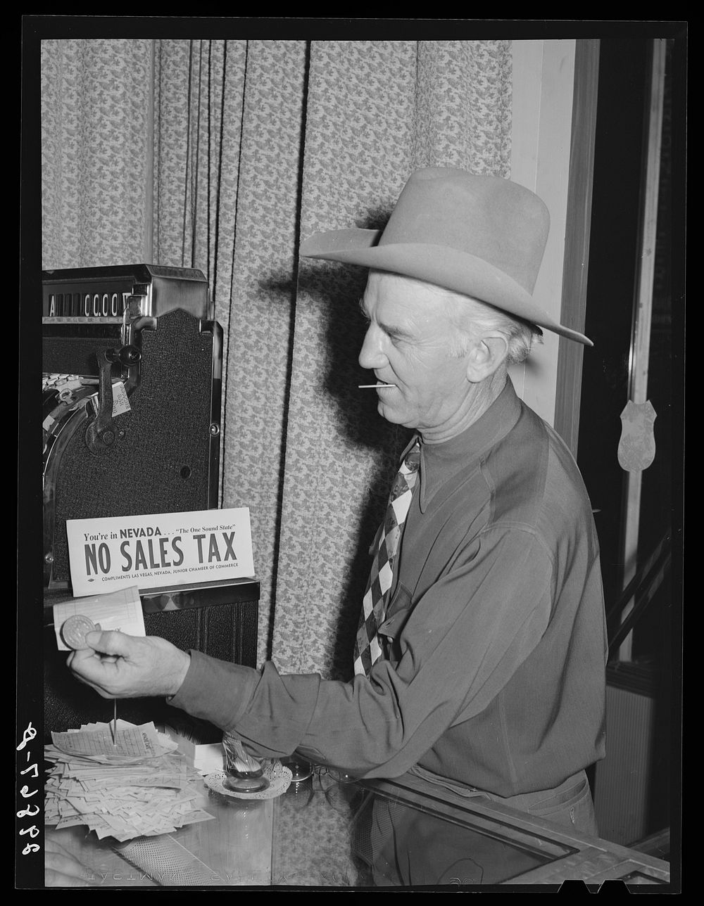 Paying the check in restaurant. Las Vegas, Nevada. Sourced from the Library of Congress.