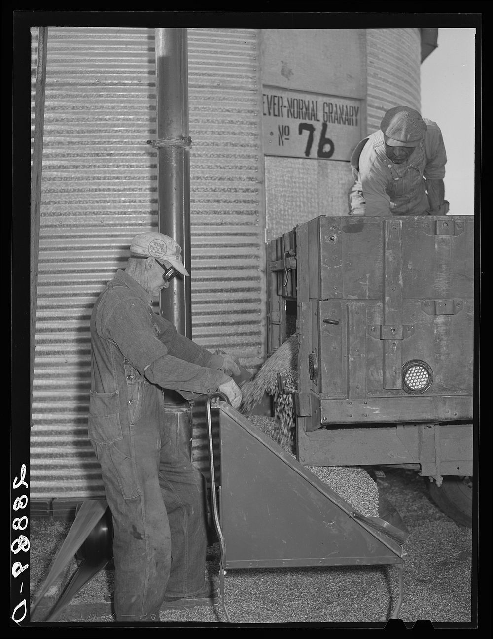 Storing corn in ever-normal granary bin. Grundy Center, Iowa. Sourced from the Library of Congress.