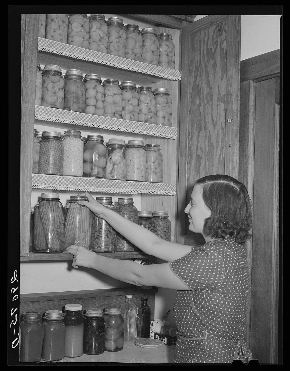Each family cans a large portion of its food raised in its own garden. Osage Farms, Missouri. Sourced from the Library of…
