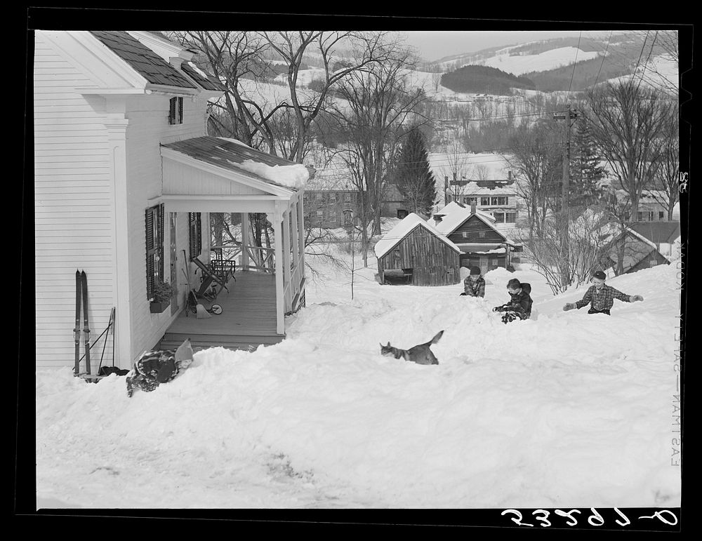 Children having snowball fight in front of their home in Woodstock, Vermont. Sourced from the Library of Congress.