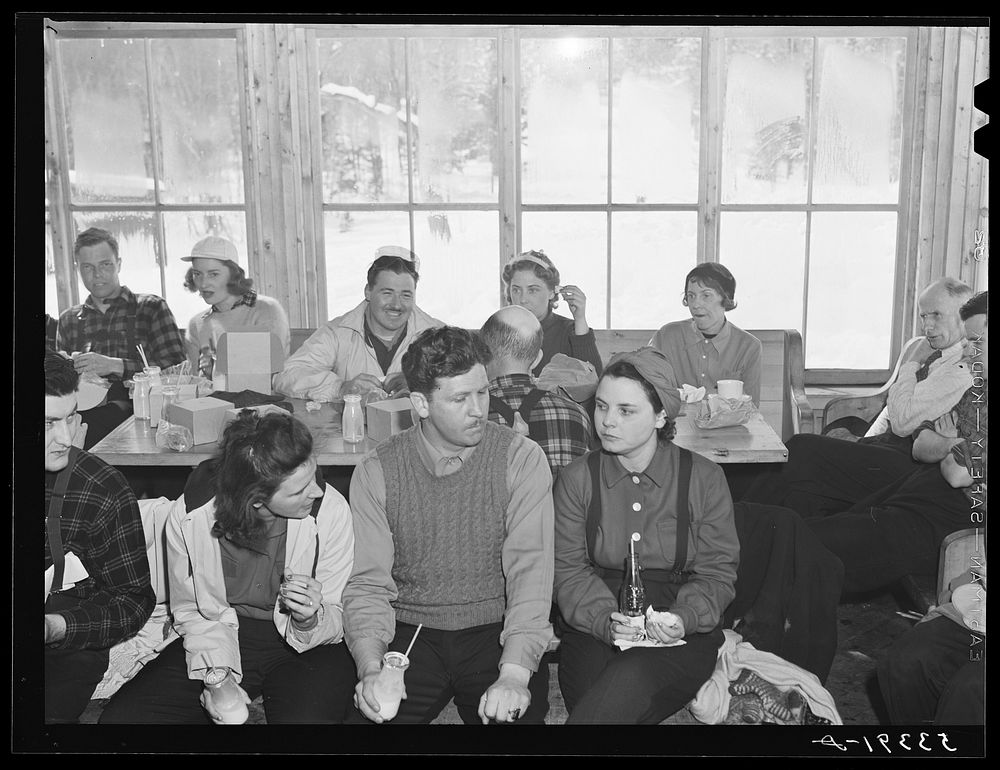 [Untitled photo, possibly related to: Skiers eating lunch in tollhouse at foot of Mount Mansfield. Smugglers Notch. Near…