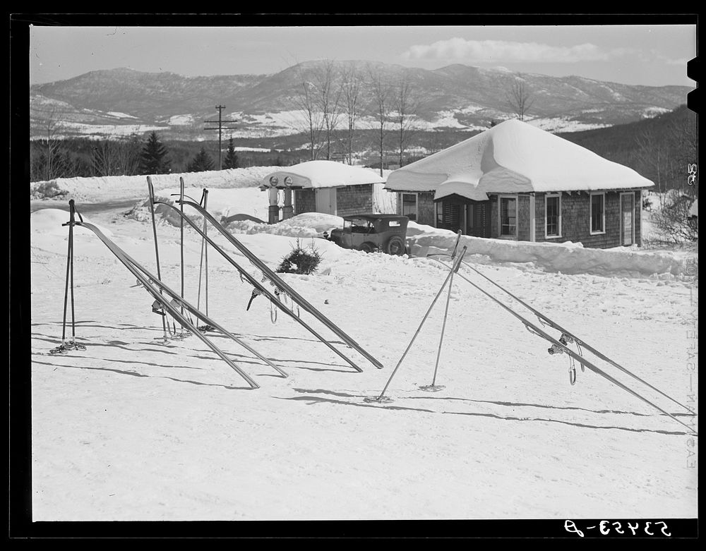Skis in the sun outside the tollhouse during lunch hours at foot of Mount Mansfield, Smugglers Notch. Near Stowe, Vermont.…