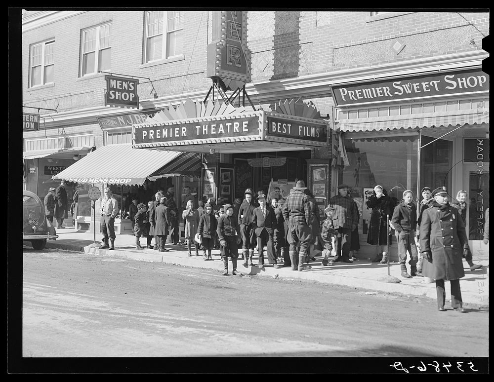 Children waiting to get in the movies on Saturday afternoon. Littleton, New Hampshire. Sourced from the Library of Congress.
