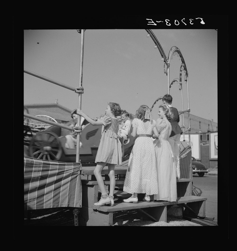 [Untitled photo, possibly related to: Children enjoying the midway after a parade at the Memphis cotton carnival. Memphis…