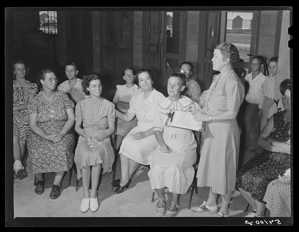 Home management supervisor Mrs. Merrin has a woman's club group discussion and meeting in the assembly building at Osceola…