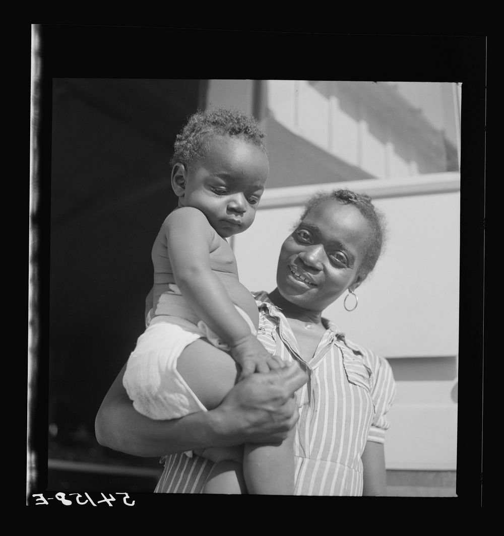 [Untitled photo, possibly related to: Mother and child at Okeechobee migratory labor camp, where they have a nurse and…