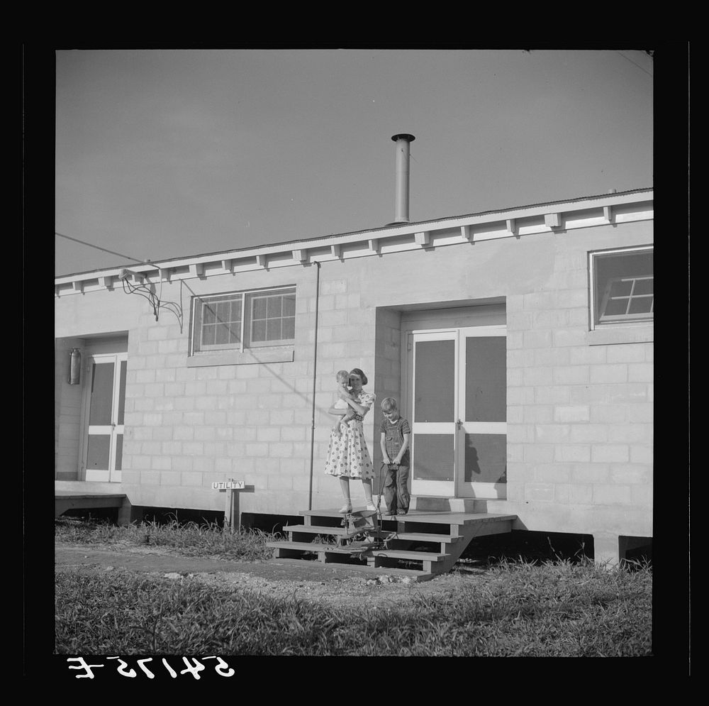 [Untitled photo, possibly related to: Children coming into utility building after their showers. It is also equipped with…