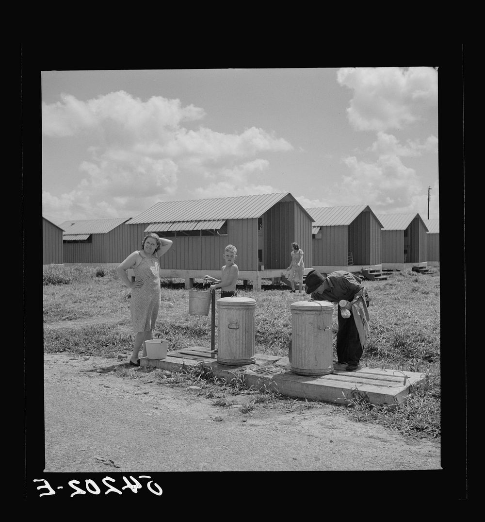 [Untitled photo, possibly related to: Running water and garbage and refuse disposal cans are placed at head of each shelter…