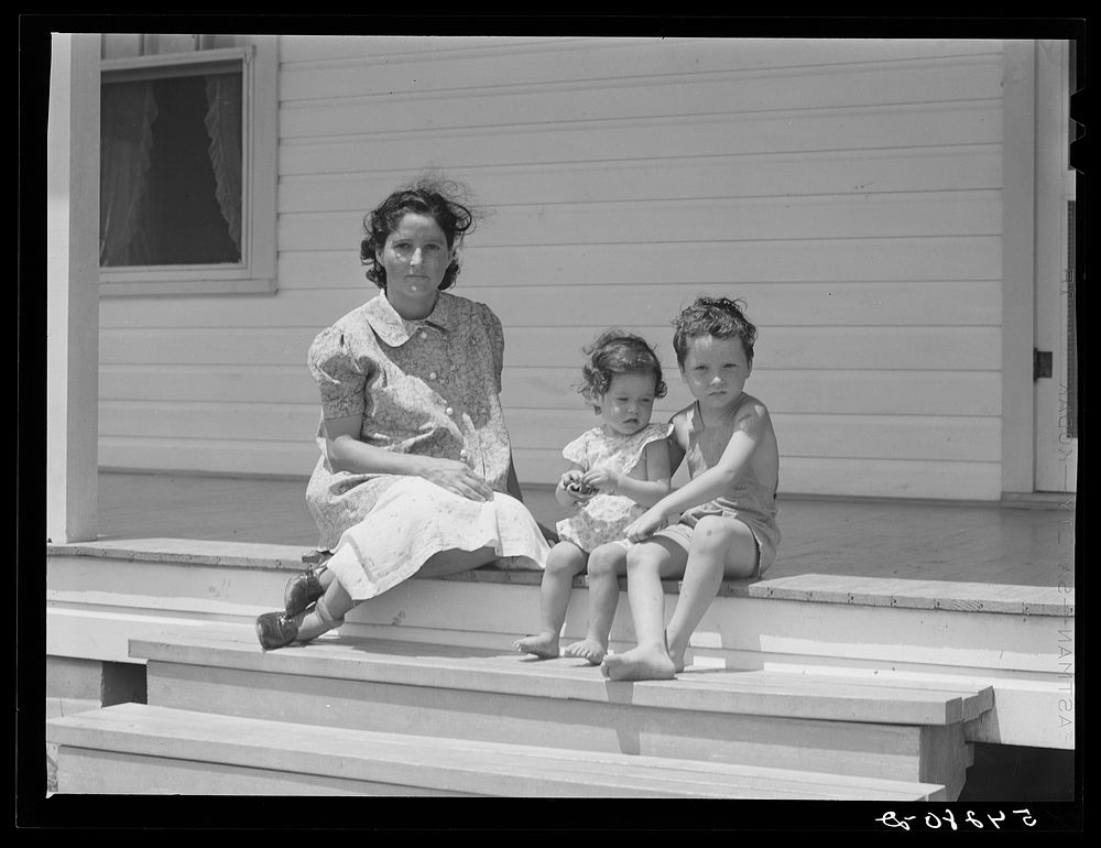 Wife and children of one of the cooperative's members on steps of their home. Terrebonne Project, Schriever, Louisiana.…