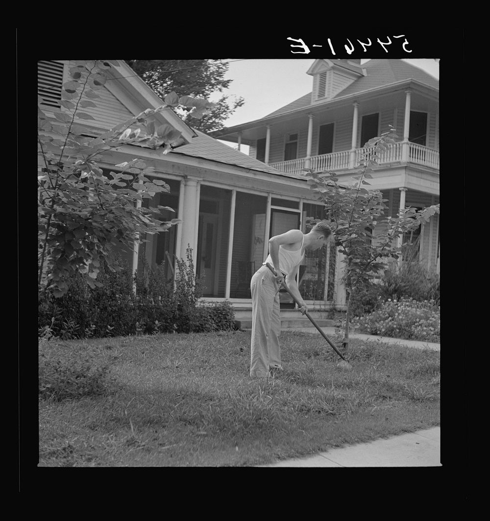 [Untitled photo, possibly related to: Man in front of his home weeding his lawn on Sunday. Natchitoches, Louisiana]. Sourced…