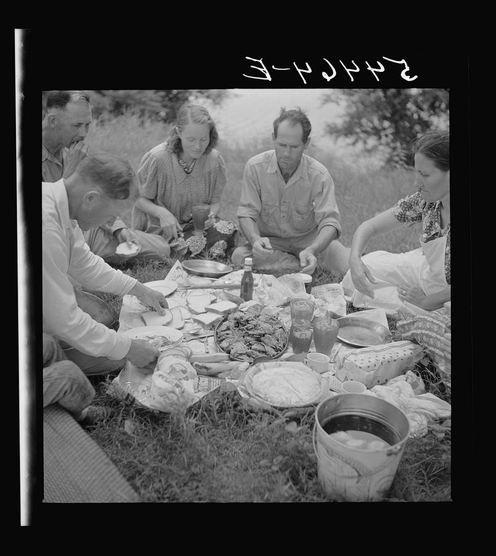 Farm family having fish fry on Fourth of July along Cane River. Near Natchitoches, Louisiana. Sourced from the Library of…