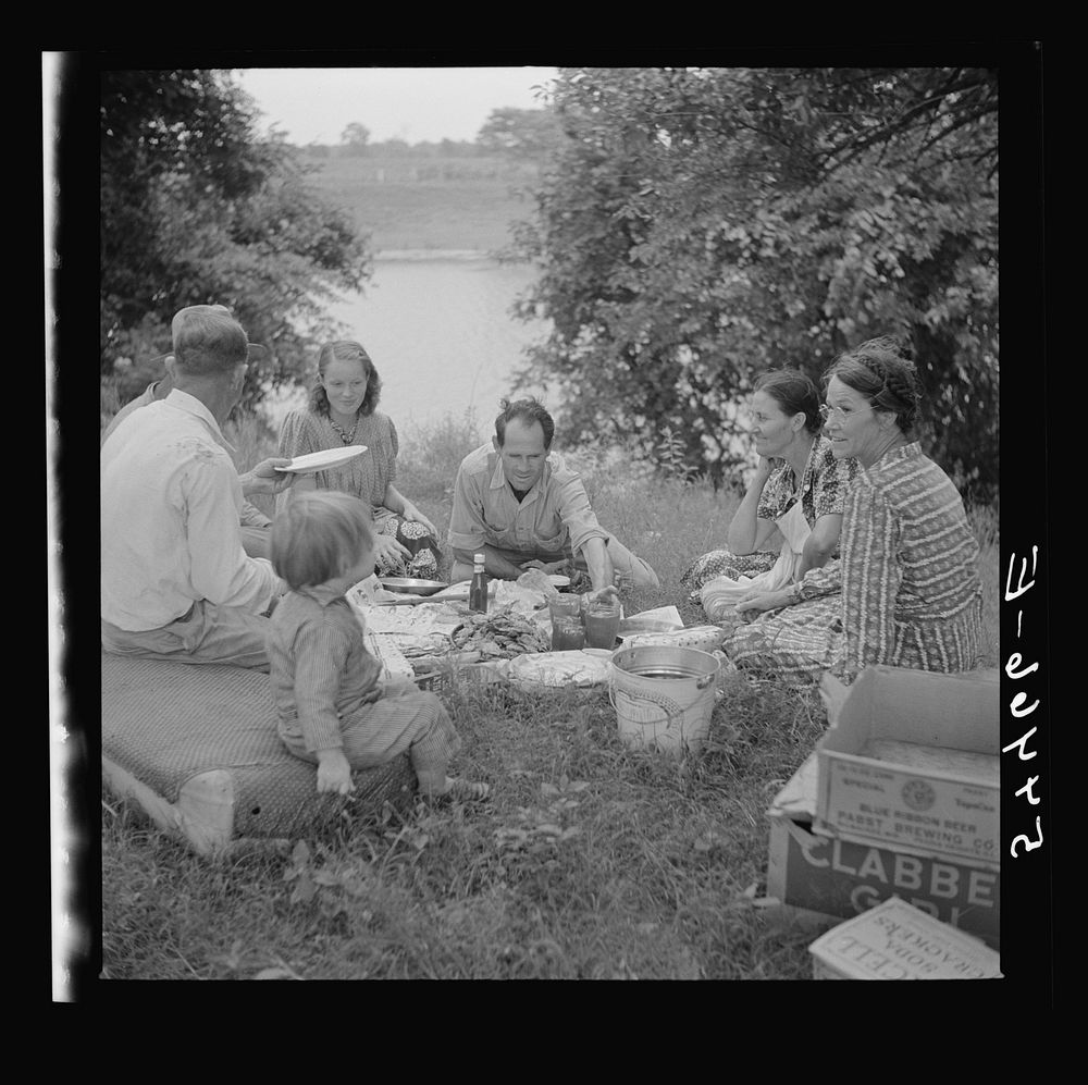 Farm family having fish fry on July Fourth along Cane River. Near Natchitoches, Louisiana. Sourced from the Library of…
