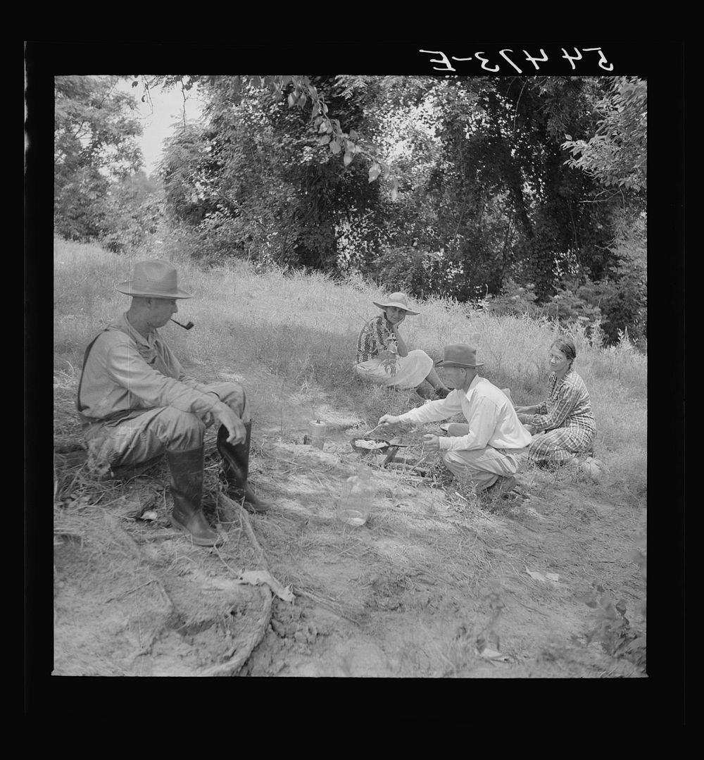 Farm family having fish fry along Cane River on Fourth of July near Natchitoches, Louisiana. Sourced from the Library of…