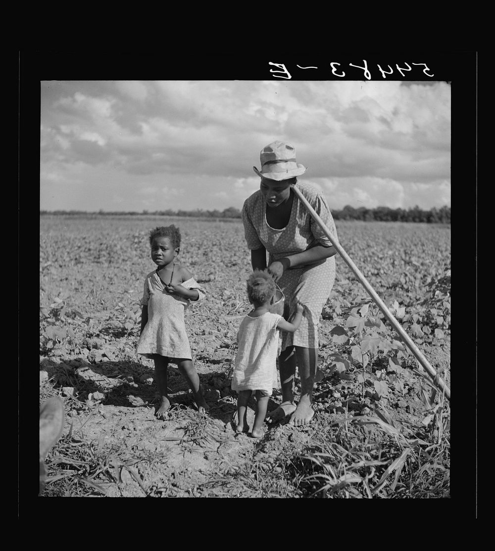 [Untitled photo, possibly related to: Member of Allen Plantation cooperative association resting while hoeing cotton. Near…