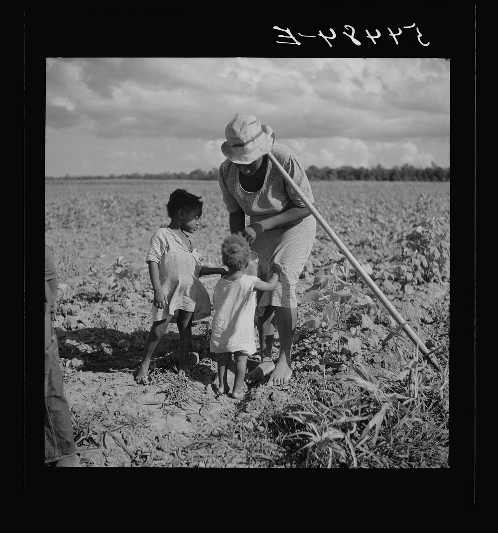 [Untitled photo, possibly related to: Member of Allen Plantation cooperative association resting while hoeing cotton. Near…