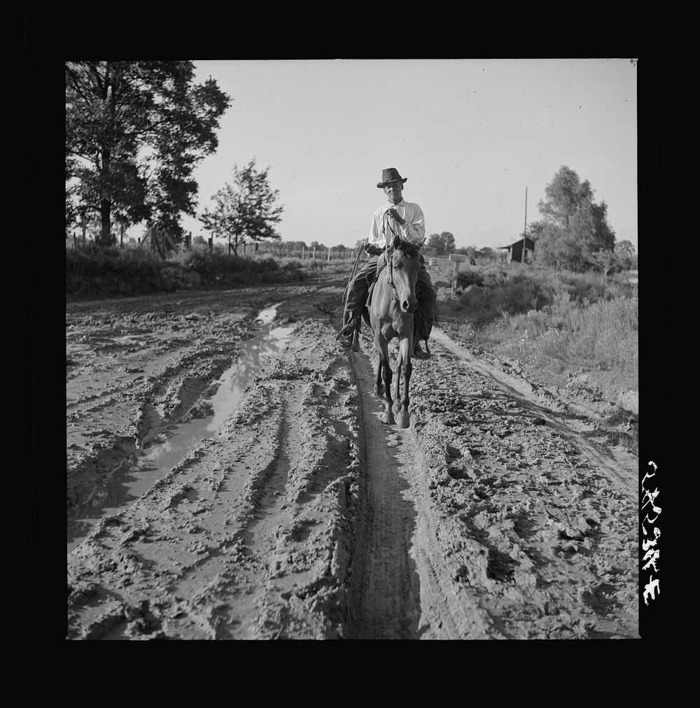 Melrose, Natchitoches Parish, Louisiana. Mulatto riding to crossroads store to get supplies after heavy rains. Sourced from…