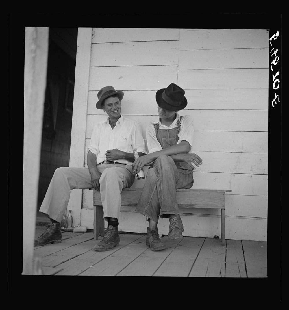 Melrose, Natchitoches Parish, Louisiana. Mulattoes sitting on the porch of country store and bar near John Henry cotton…