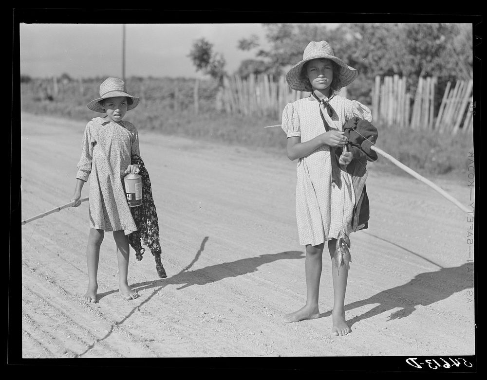 Melrose, Natchitoches Parish, Louisiana. Children of mulatto family returning home after an afternoon fishing in Cane River.…