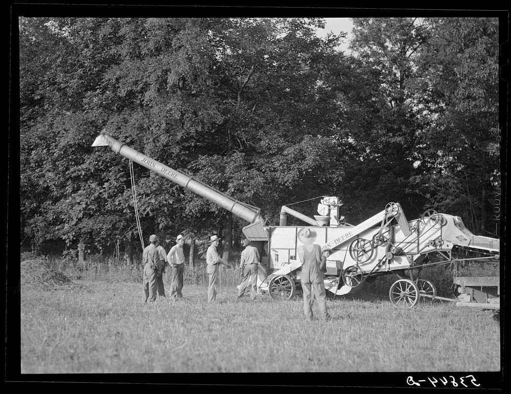 [Untitled photo, possibly related to: Cooperative oat thrasher, purchased by E.H. Lester through FSA (Farm Security…
