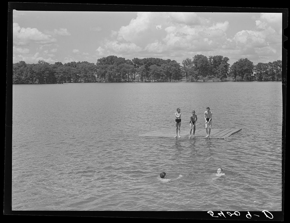 On Saturday afternoons and Sundays boys and children from nearby farms and neighborhoods go swimming in Lake Providence…