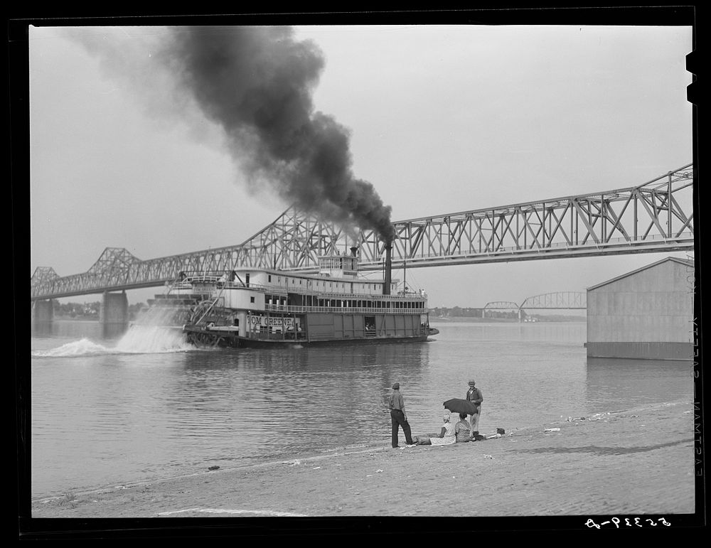 Riverboat carrying cargo leaving dock along waterfront on Ohio River. Louisville, Kentucky. Sourced from the Library of…