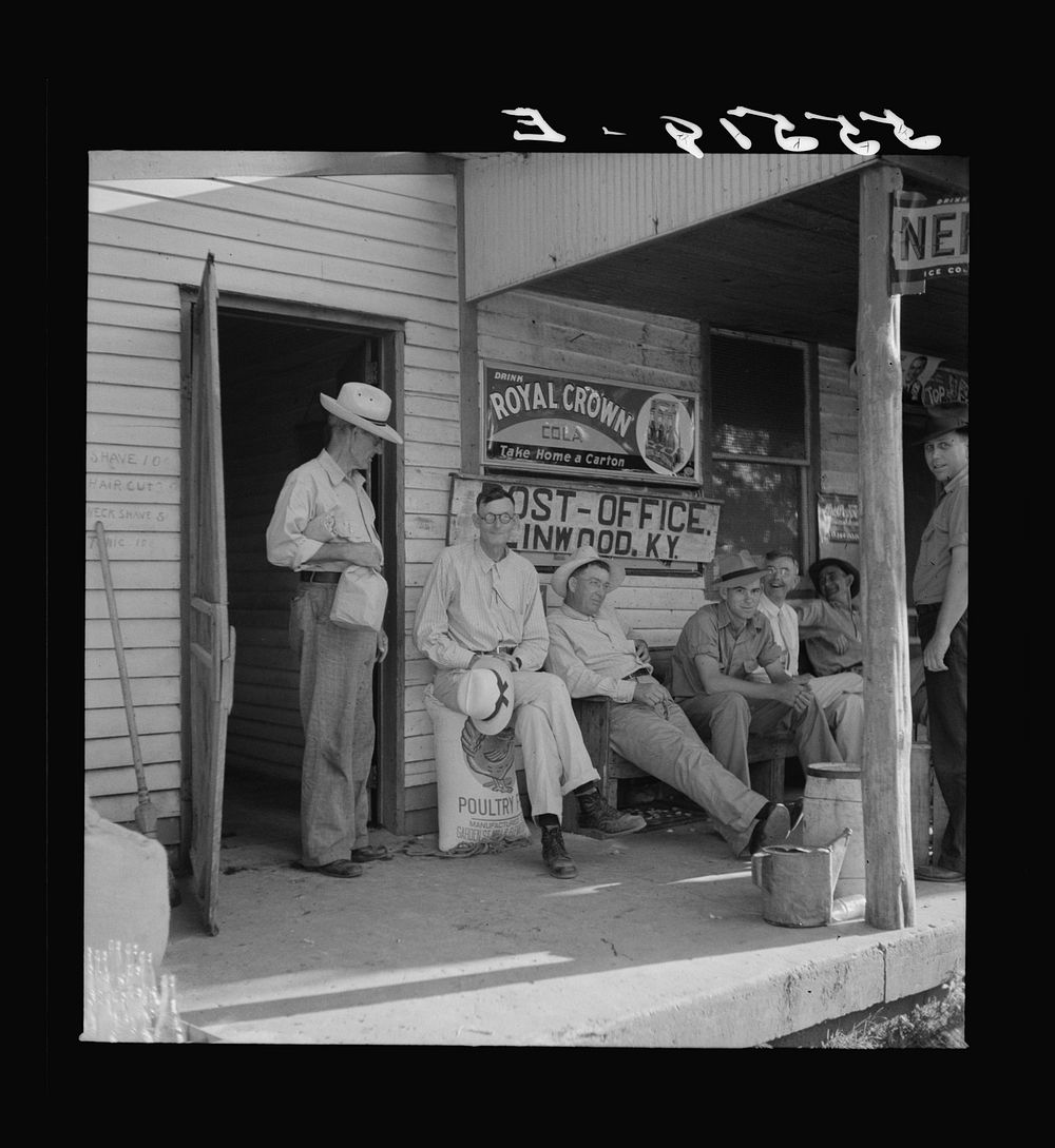 Farmers exchanging news and greetings in front of post office in Linwood, Kentucky. Sourced from the Library of Congress.