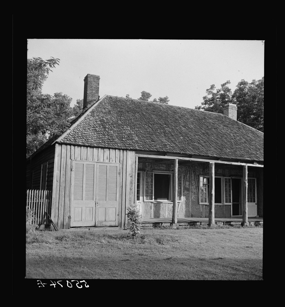 [Untitled photo, possibly related to: Melrose, Natchitoches Parish, Louisiana. Old home with mud walls built by mulattoes…