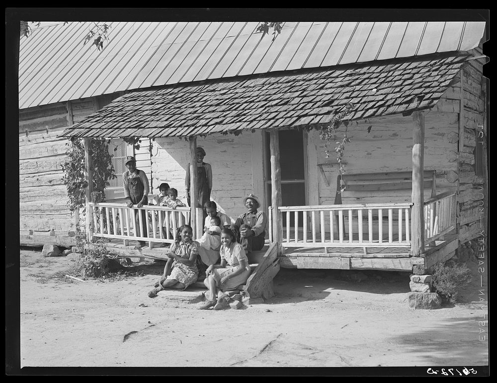 FSA (Farm Security Administration) borrower's family,  tenants, on porch of their home in Caswell, North Carolina. Sourced…
