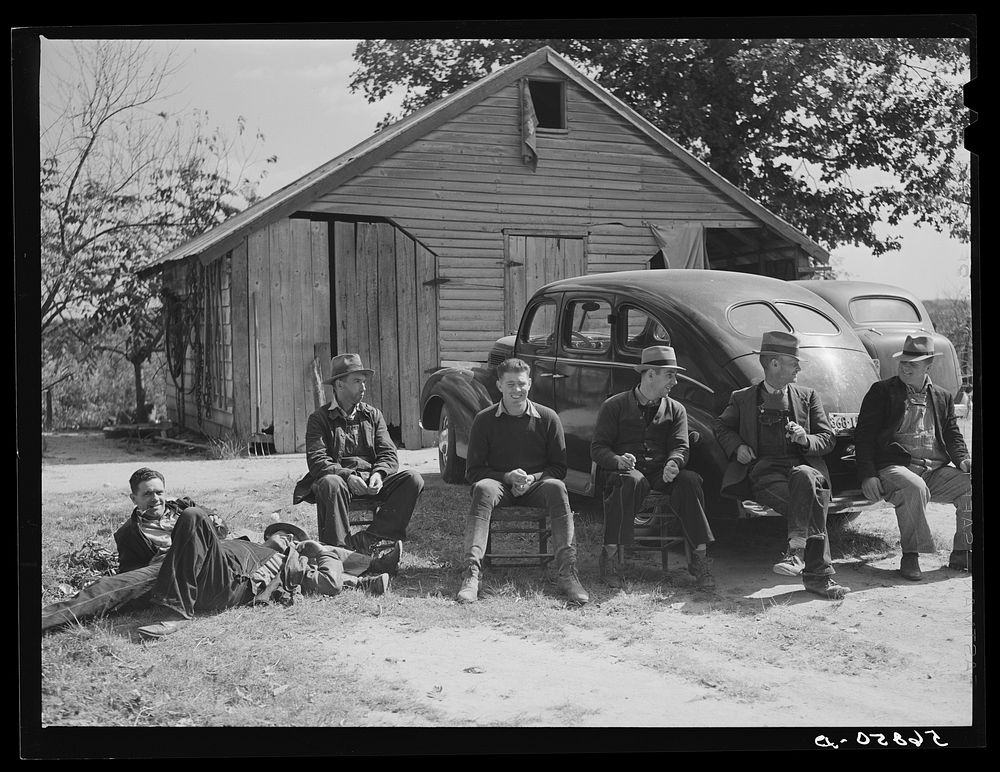 Resting after dinner following a corn shucking on Hooper Farm in Corbett Ridge section. Caswell County, North Carolina.…