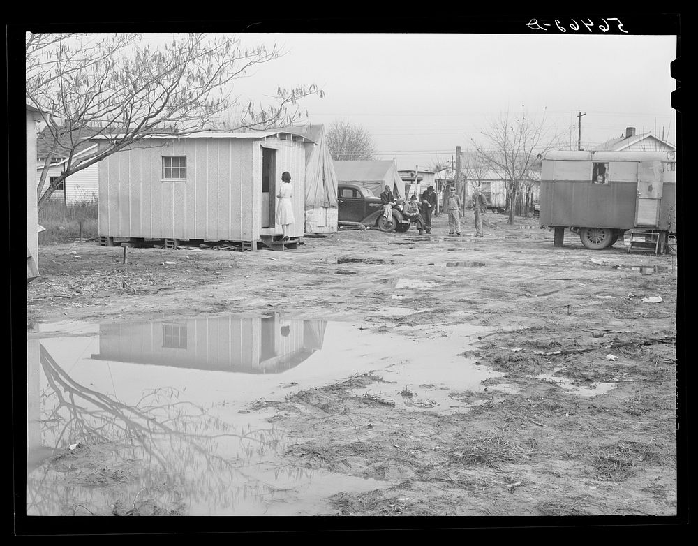 [Untitled photo, possibly related to: Columbus, Georgia. Metal shelters and tents of Army men and construction workers in…