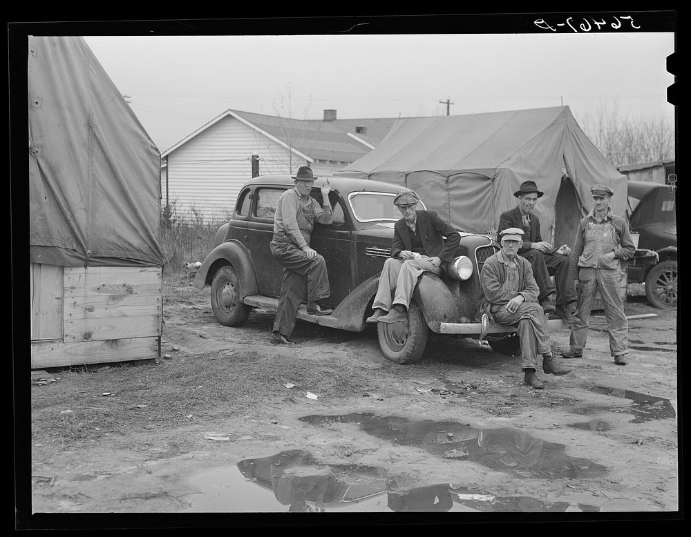 Men on car by tents. Construction workers in front of tents. Names: William Allen Jones, Fort Benning, Paul Knight, Fort…