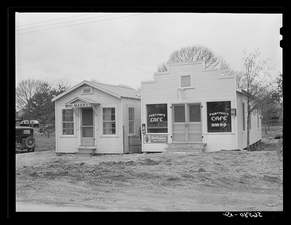 The new meat market and Portman cafe. Forest Hill, by Camp Claiborne, near Alexandria, Louisiana. Sourced from the Library…