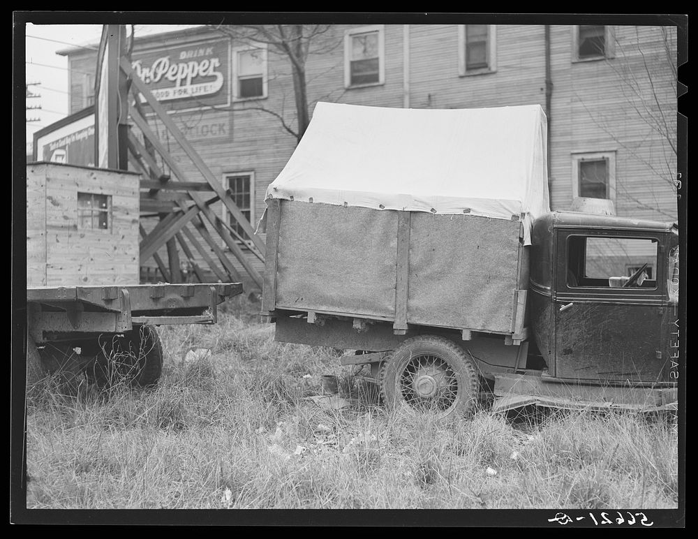 [Untitled photo, possibly related to: Converted canvas-topped truck (self-built), used by six construction workers for the…