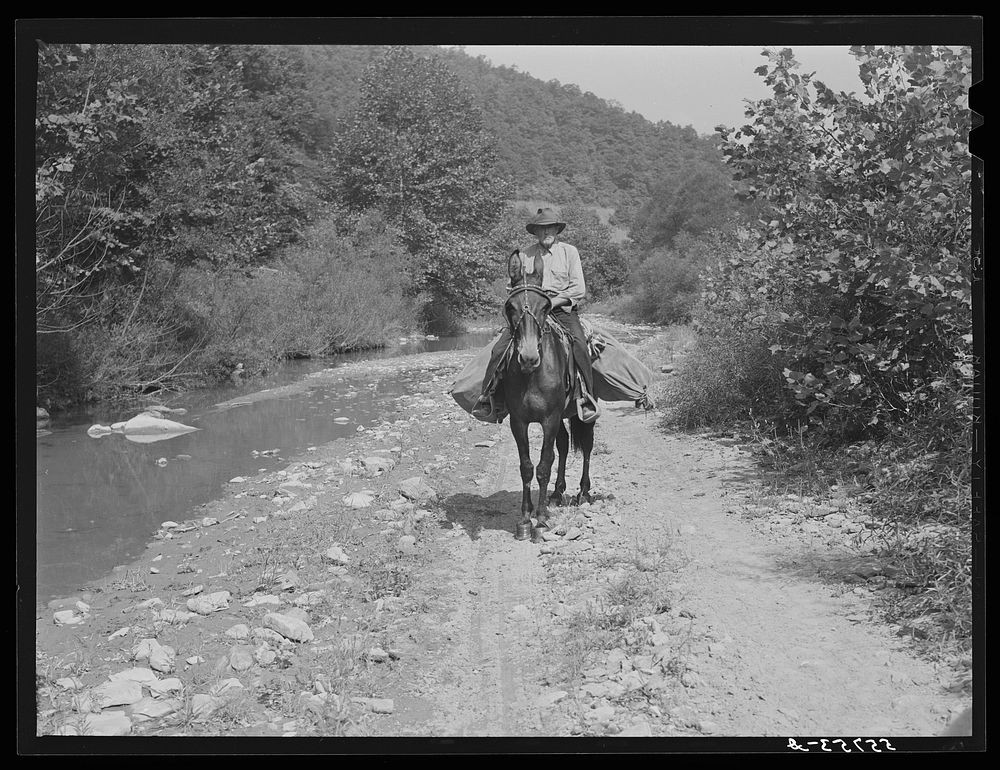 Rural mailman going up the creek bed toward Morris Fork near Jackson, Kentucky. Sourced from the Library of Congress.