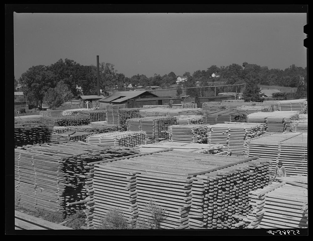 Stacks of lumber and sawmill. Pittsboro, Chatham County, North Carolina. Sourced from the Library of Congress.