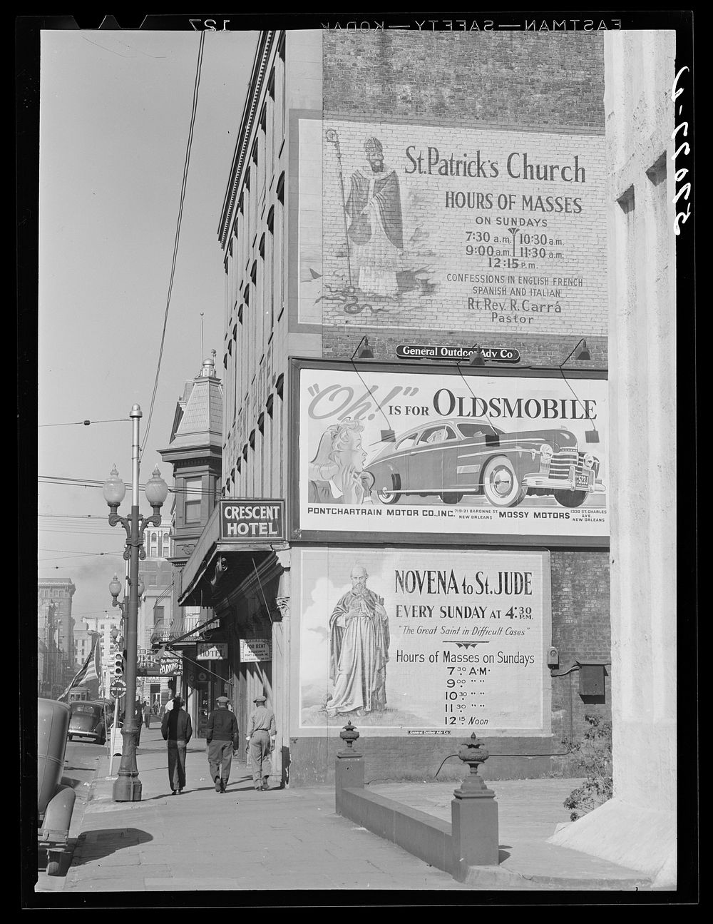 Billboards on side of building in New Orleans, Louisiana. Sourced from the Library of Congress.
