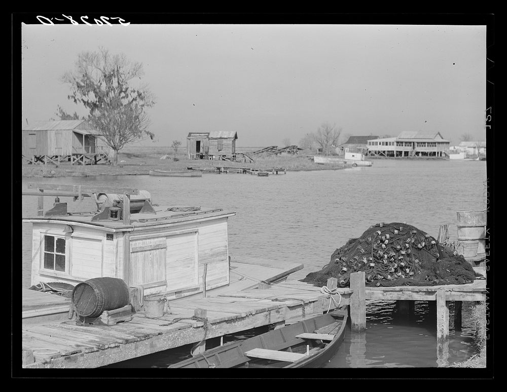 Trappers' and fishermen's boats and homes along the bayou. Delacroix Island, Louisiana. Sourced from the Library of Congress.