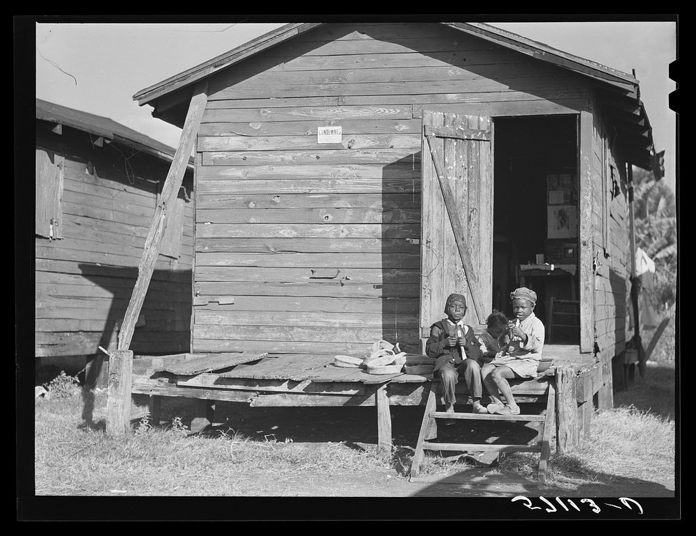Houses condemned by board of health still lived in by migratory laborers. Sourced from the Library of Congress.