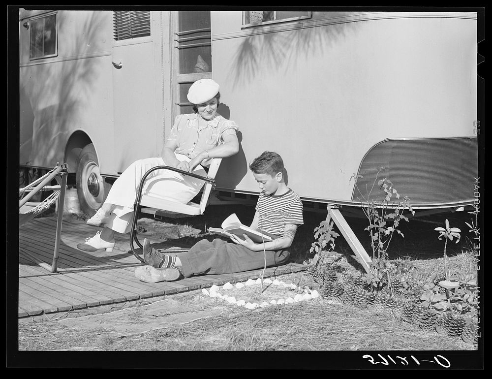 Mother listening to son read. Sarasota trailer park, Sarasota, Florida. Sourced from the Library of Congress.
