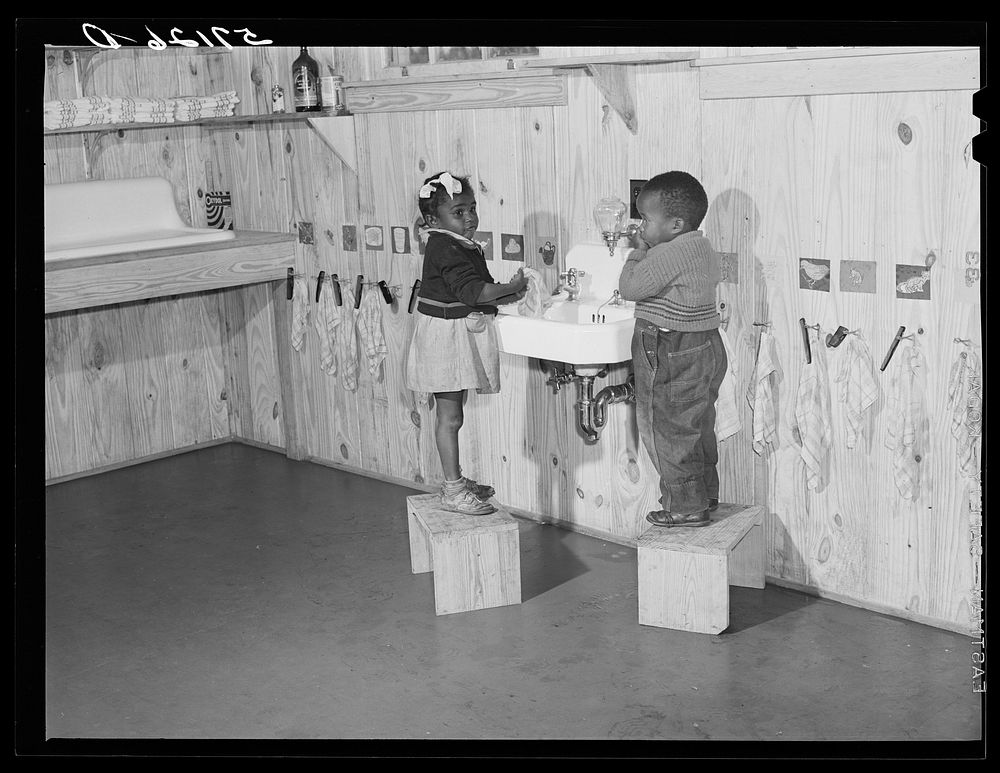 Agricultural workers' children washing up before a hot lunch in day nursery at Okeechobee migratory labor camp. Belle Glade…