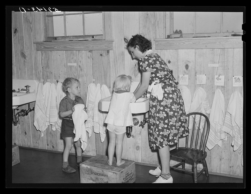 Children of agricultural and packing house workers washing up before getting a hot lunch in twenty-four hour a day nursery…
