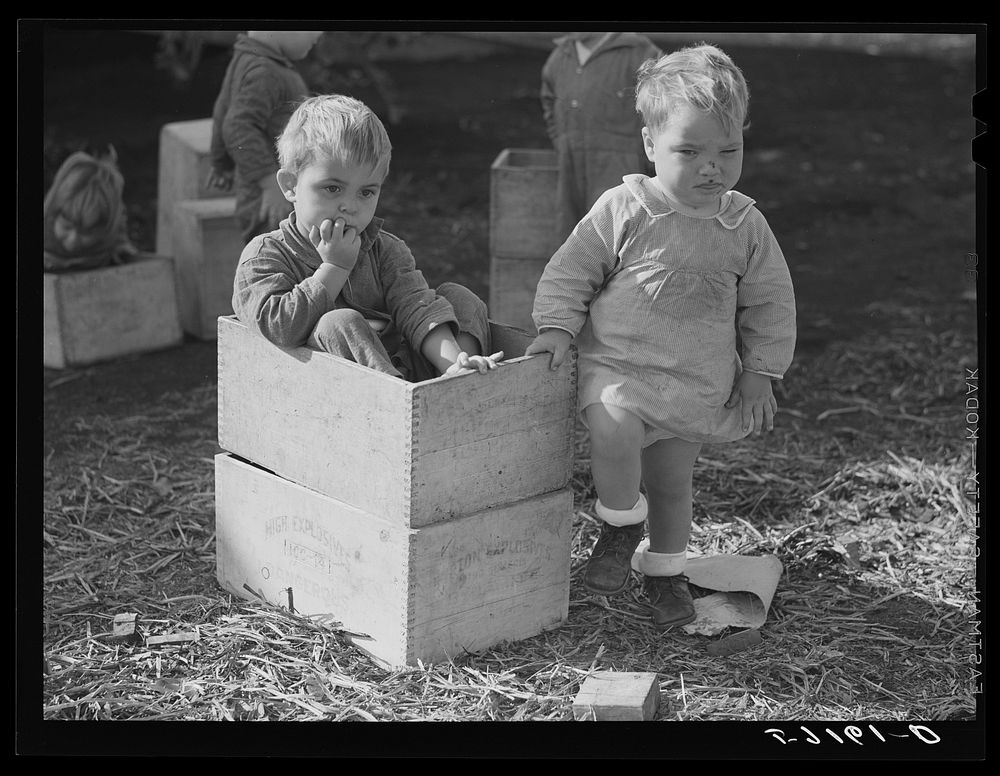 Agricultural and packing house workers' children playing outside of twenty-four hour a day nursery at Osceola migratory…