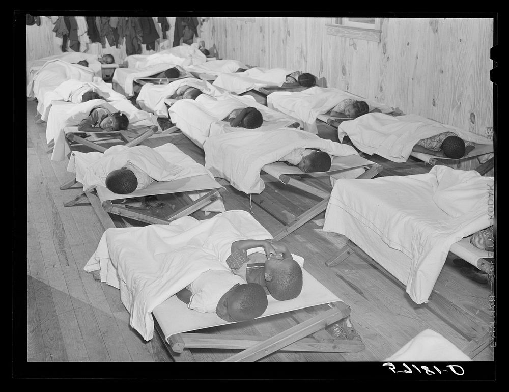 Rest hour in day nursery of Okeechobee migratory labor camp. Belle Glade, Florida. Sourced from the Library of Congress.