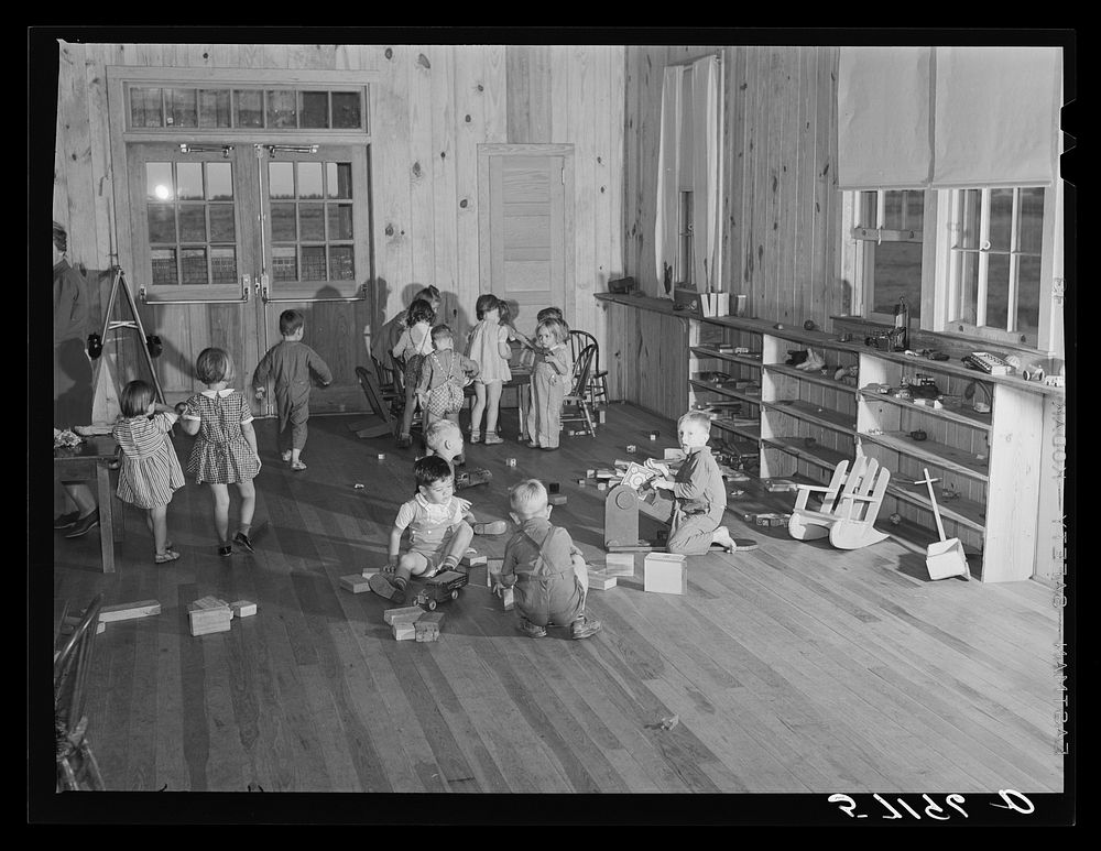 Agricultural and packing house workers' children playing in the twenty-four hour a day nursery at Osceola migratory labor…
