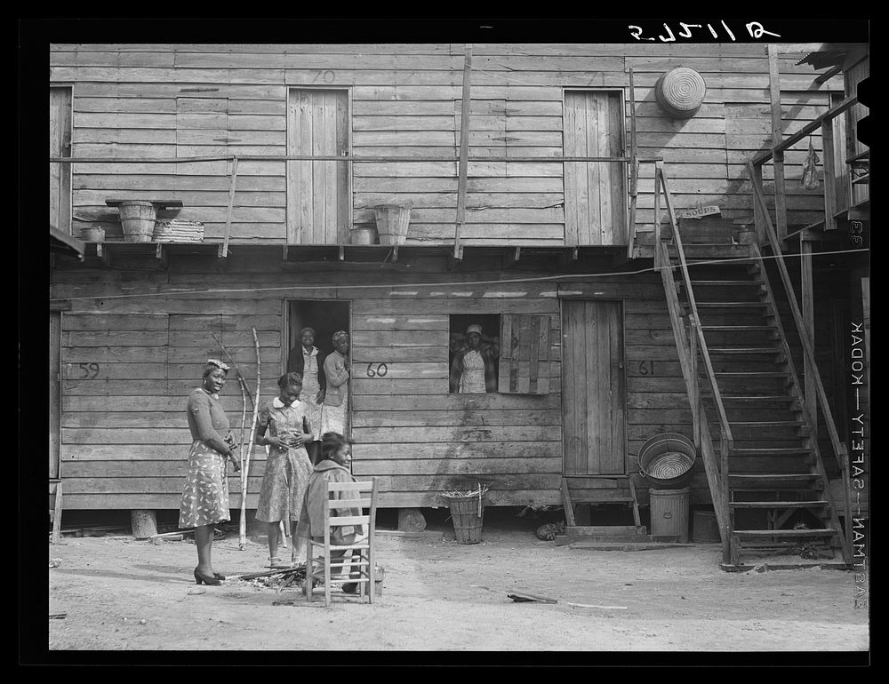 [Untitled photo, possibly related to: "Hotel" in Pahokee, Lake Okeechobee, Florida, living quarters for migratory…