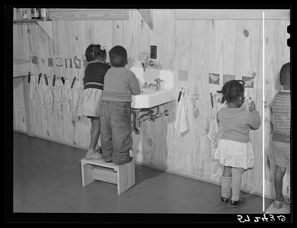 Children in the day nursery washing up before getting their hot lunch at Okeechobee migratory labor camp. Belle Glade…