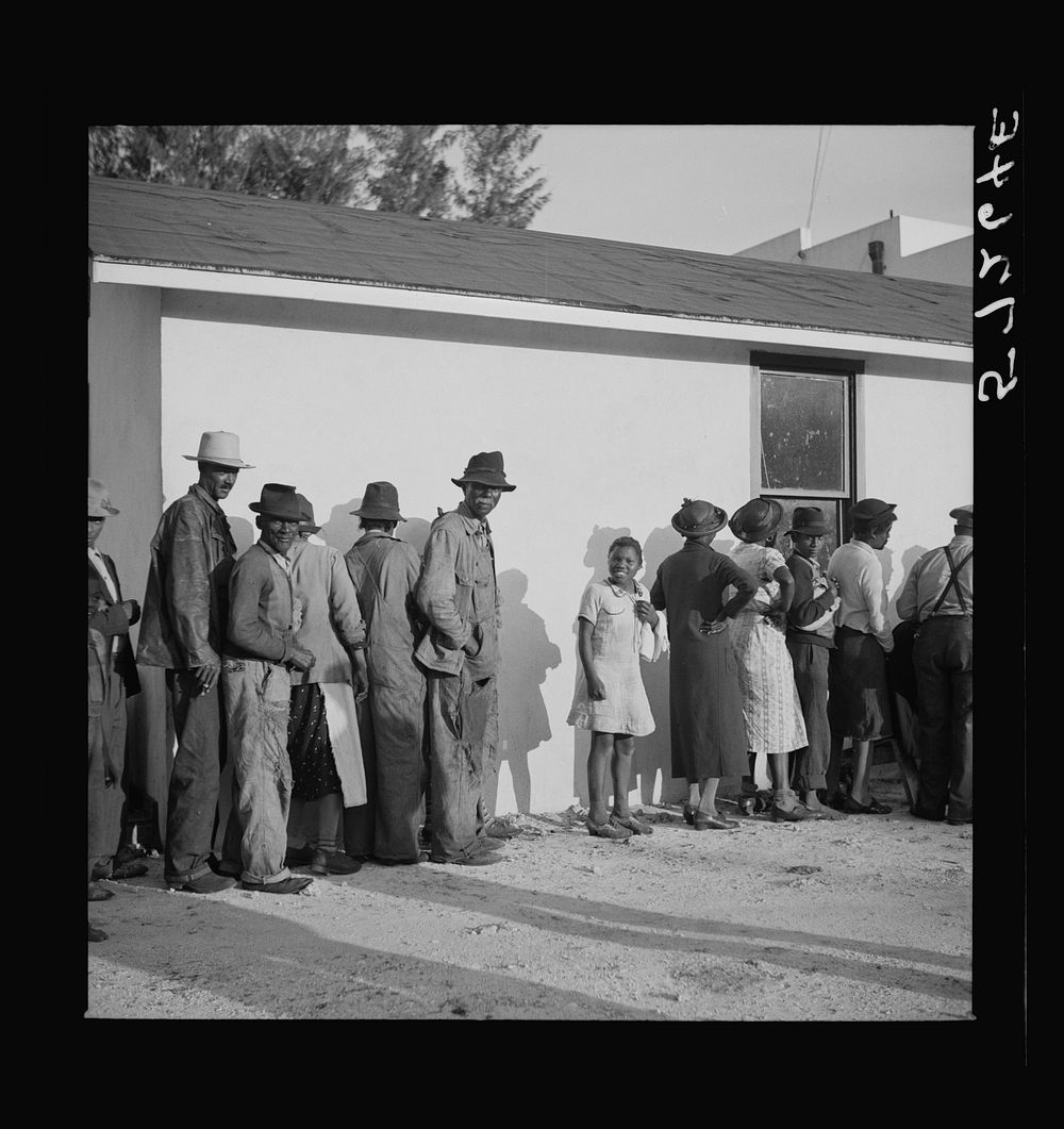 [Untitled photo, possibly related to: Migratory workers waiting to receive supplies of surplus commodities. Belle Glade…